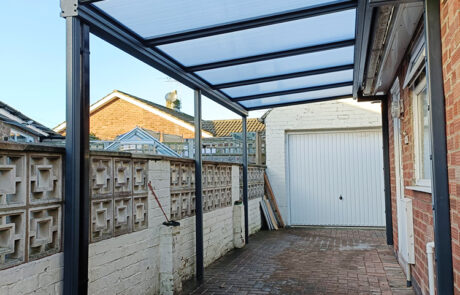 Robust and Practical Simplicity 16 carport installation in York at domestic home bungalow, installed by our Trade Partner Alfresco Canopies