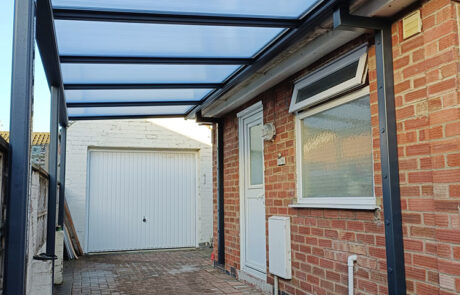 Robust and Practical Simplicity 16 carport installation in York at domestic home bungalow, installed by our Trade Partner Alfresco Canopies